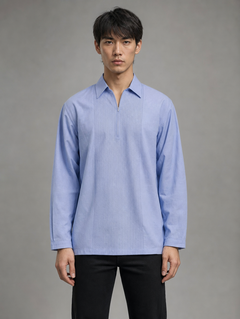 Men's light blue long sleeve short kurta shirt with a spread collar, zipper neck, and vertical pleated front paired with black pants.