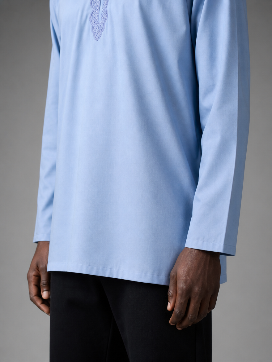 Lower front view of men's light blue short kurta showing straight hemline and long sleeves.