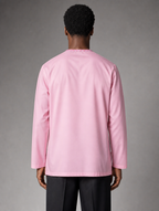 Back view of Urban Crescent men's light pink long-sleeve short kurta showing tailored fit and clean neckline embroidery.