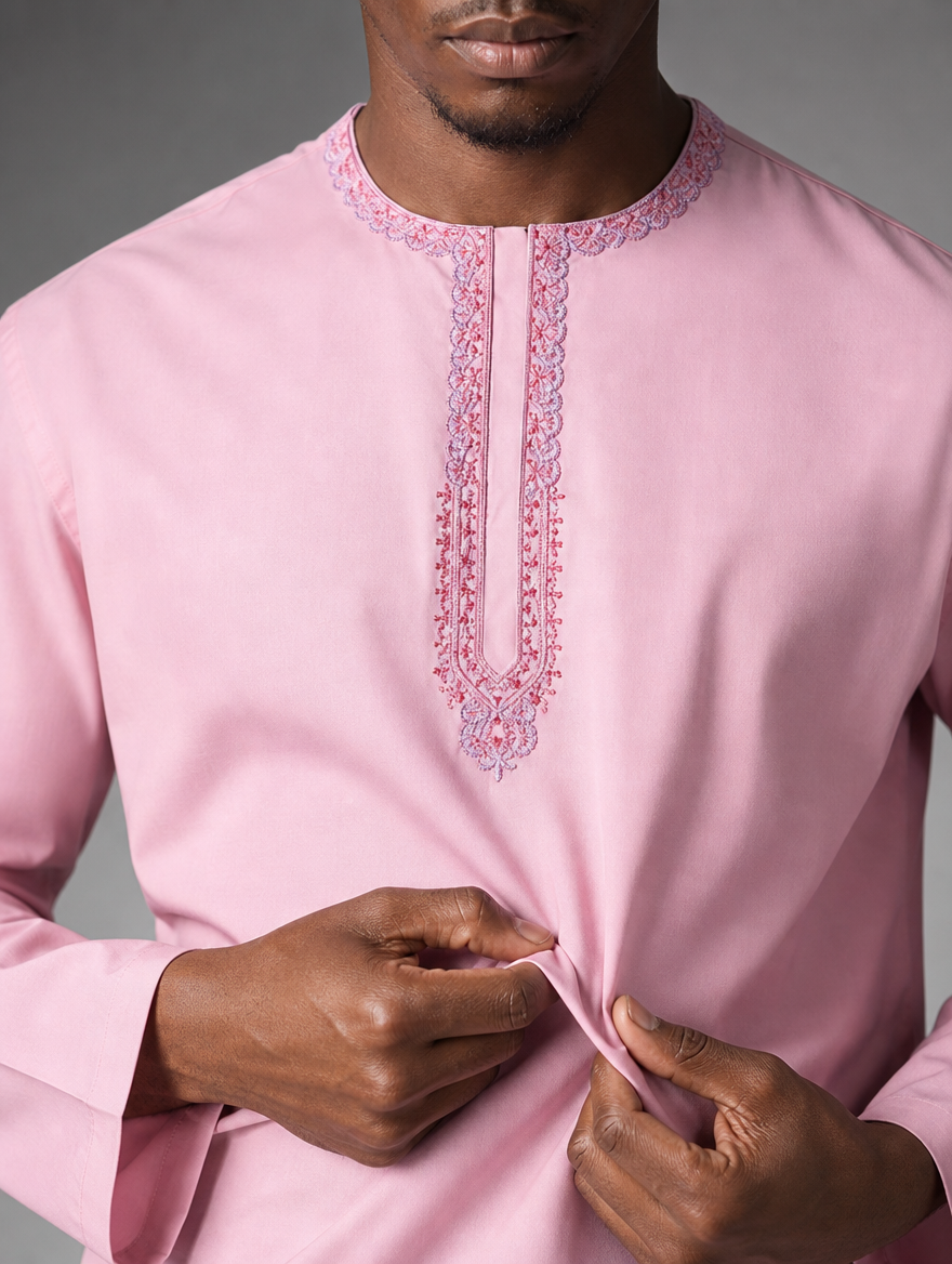 Close-up of Urban Crescent soft light pink short kurta fabric texture and embroidered neckline placket detailing.